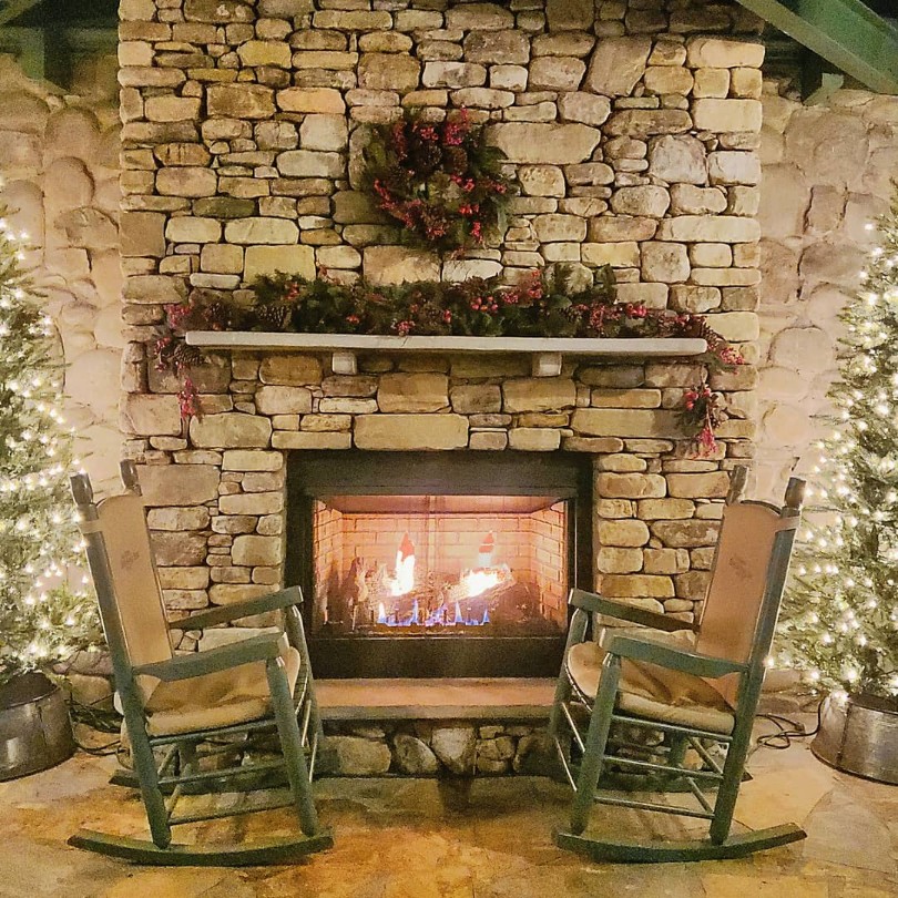 fireplace with rocking chairs at christmas