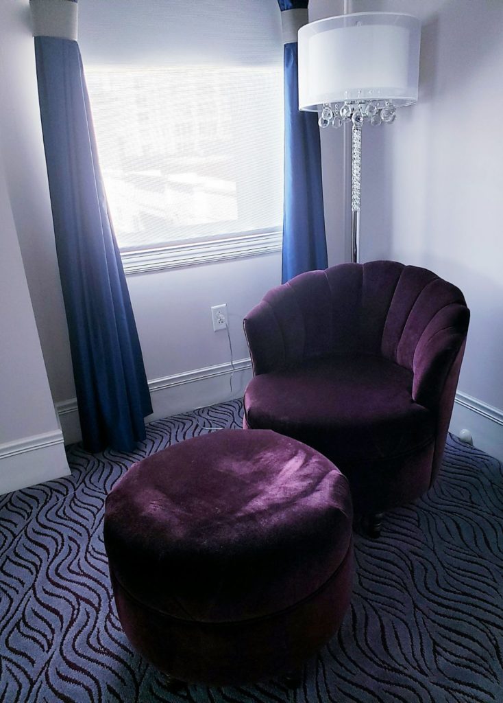 purple chair in read house suite